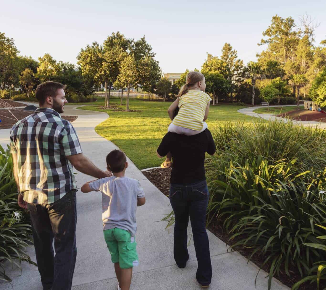 A family strolling through a park in New Braunfels.